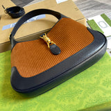 Handle and strap detail of polished structured women's handbag – women's designer-style accessory