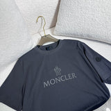 Side profile of Moncler luxury clothing with signature branding