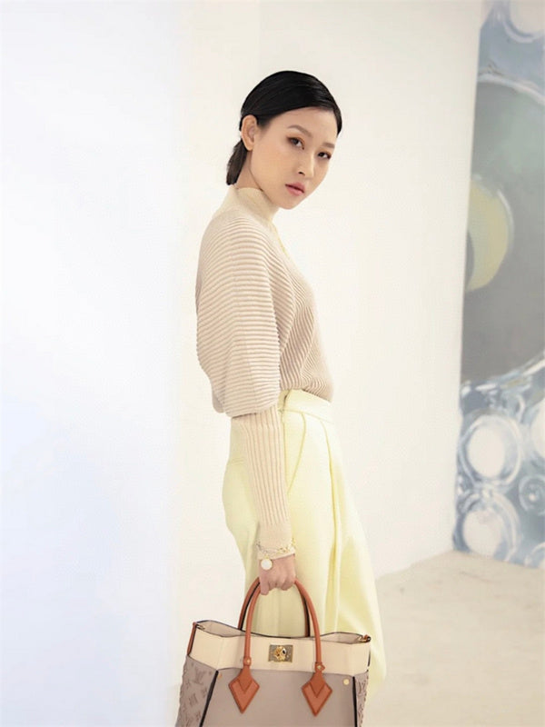  Graceful top-handle bag carried on shoulder