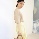  Graceful top-handle bag carried on shoulder