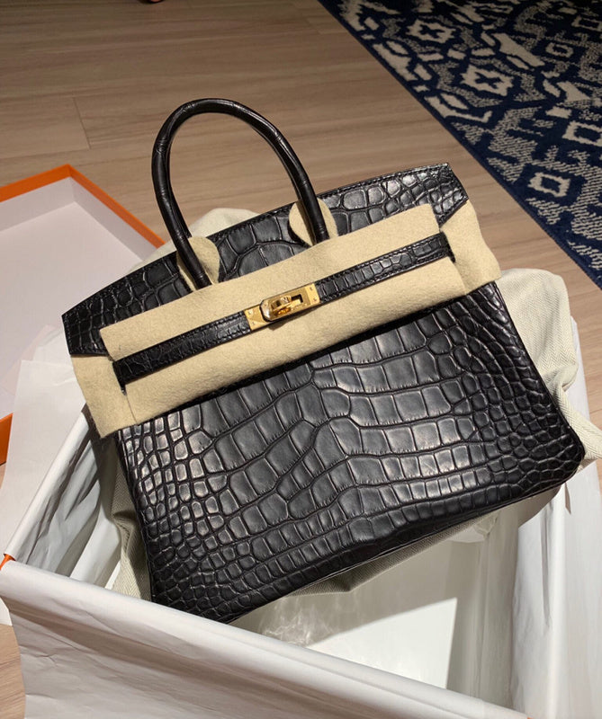 Side view of structured structured handbag