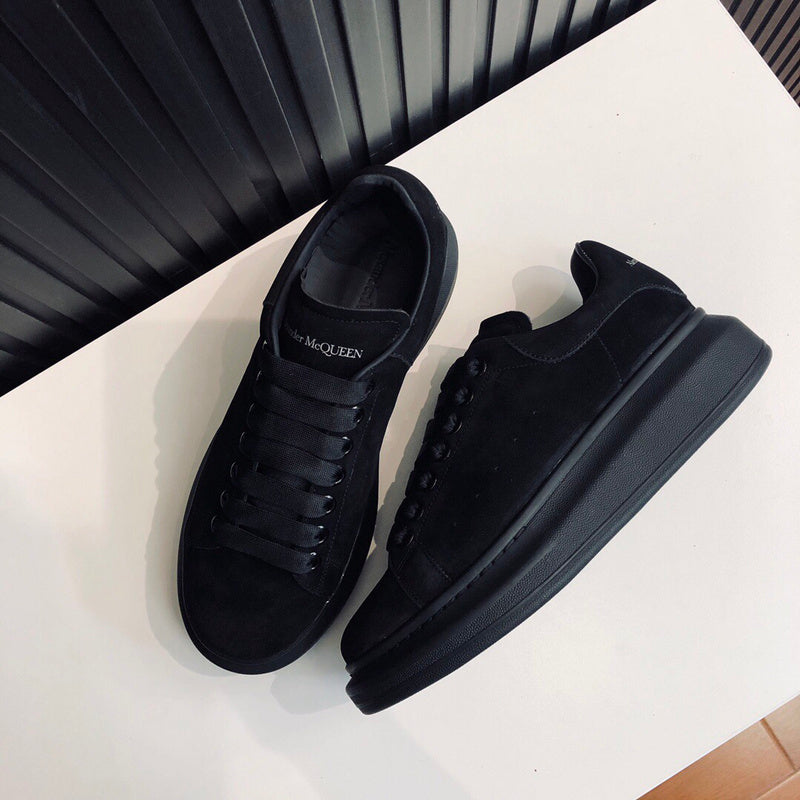 Alexander McQueen Luxury sneakers in tonal black classic court silhouette front view