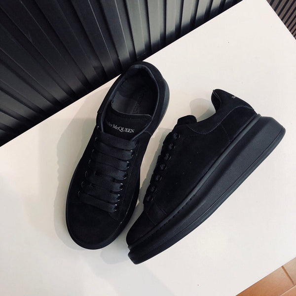 Alexander McQueen Luxury sneakers in tonal black classic court silhouette front view