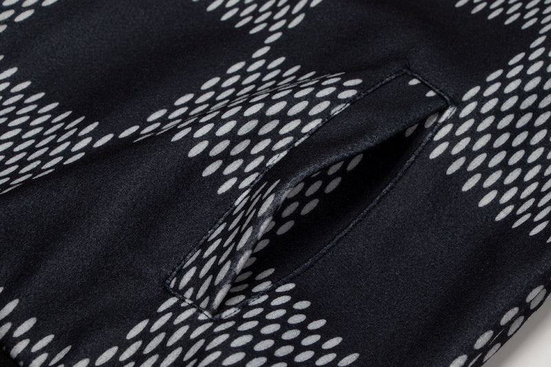 Side profile of Louis Vuitton luxury clothing with signature branding