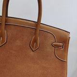 Side view of curated structured handbag