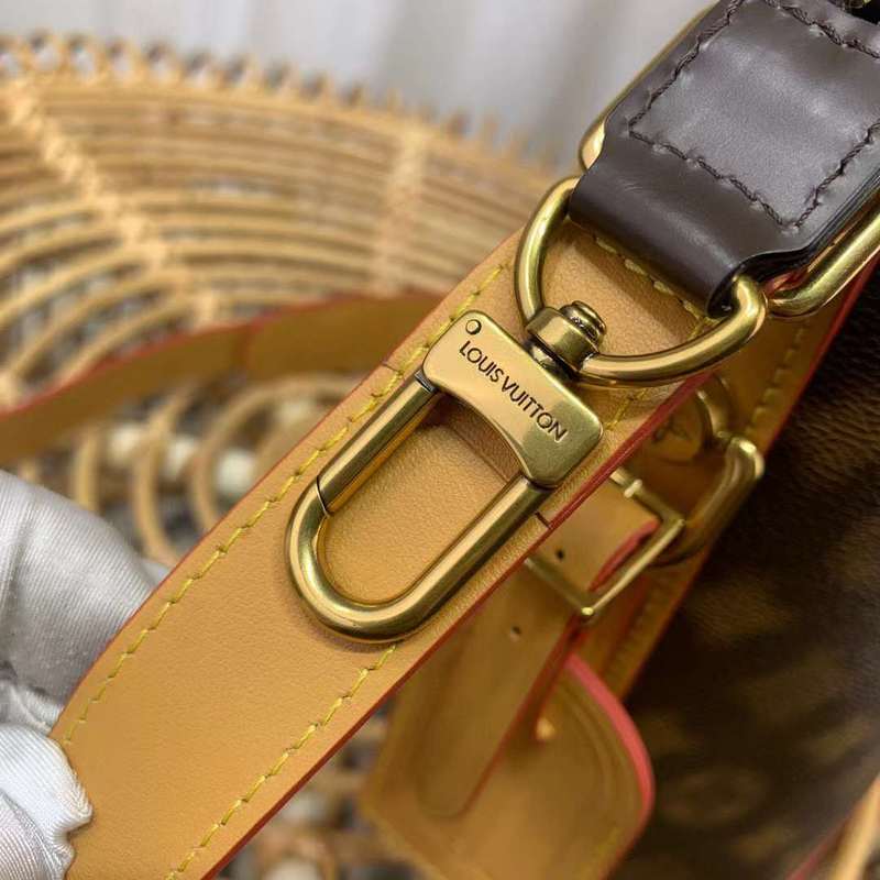 Handle and strap detail of classic signature women's handbag – women's designer-style accessory