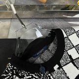 Close-up detail shot of Louis Vuitton luxury clothing with runway-inspired design