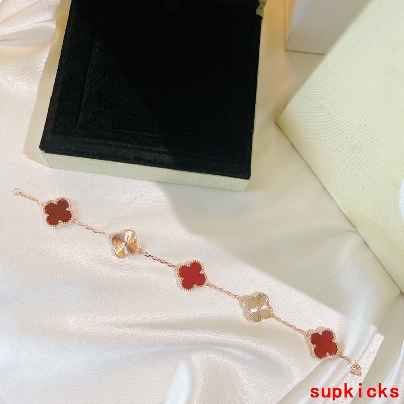 Lifestyle view of Van Cleef & Arpels unisex jewelry piece