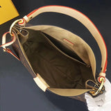 Front view of polished elevated women's handbag – women's statement bag