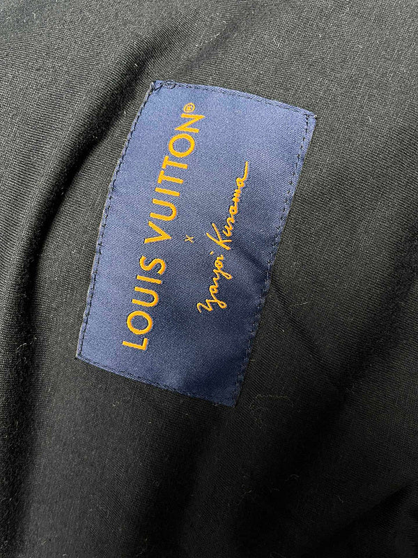 Close-up detail shot of Louis Vuitton luxury clothing with logo-detail design