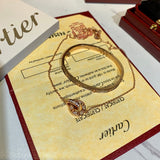 Angled view of Cartier unisex jewelry piece