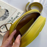 Side view of poised structured handbag