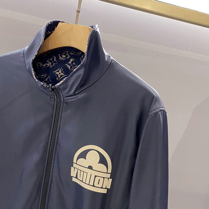 Flat lay presentation of Louis Vuitton luxury clothing with signature branding