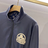 Flat lay presentation of Louis Vuitton luxury clothing with signature branding