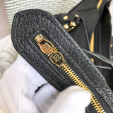 Styled lifestyle shot of structured premium women's handbag – women's luxury accessory