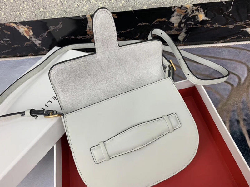 Handle and strap detail of modern polished women's handbag – women's everyday handbag