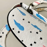 Handle and strap detail of refined sleek women's handbag – women's designer-style accessory