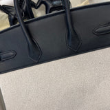 Side view of considered structured handbag