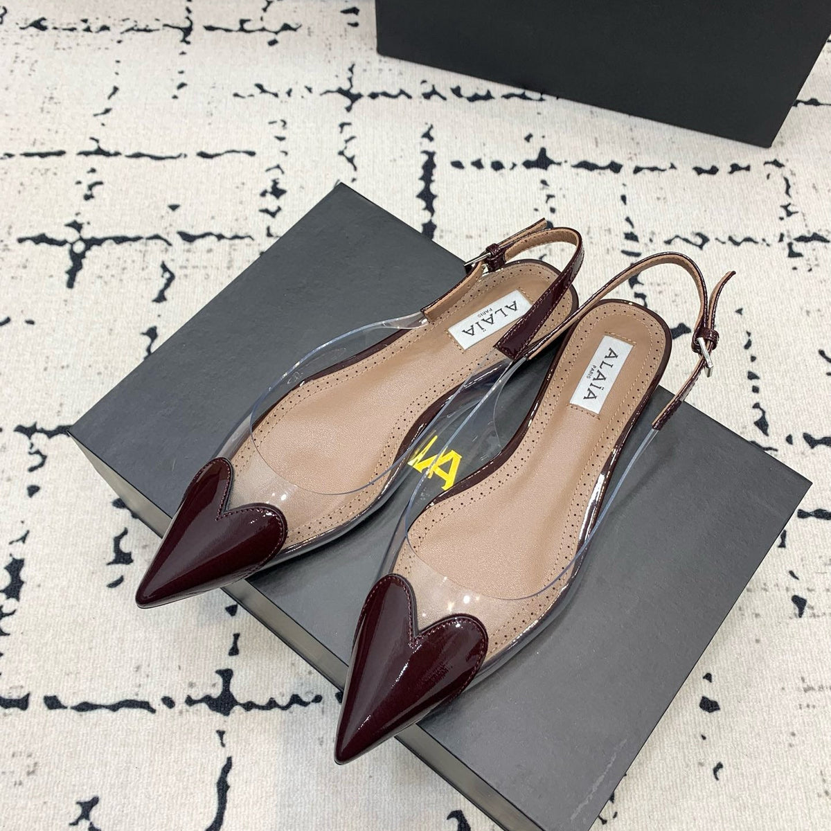 Front view of Alaïa Flats premium footwear
