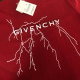 Flat lay presentation of Givenchy luxury clothing with signature branding
