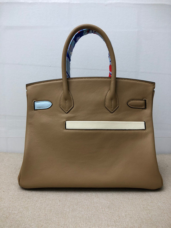 Close-up detail of statement bag design
