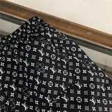 Flat lay presentation of Louis Vuitton cotton t-shirt with runway-inspired design