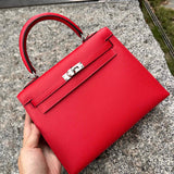 Side view of streamlined structured handbag