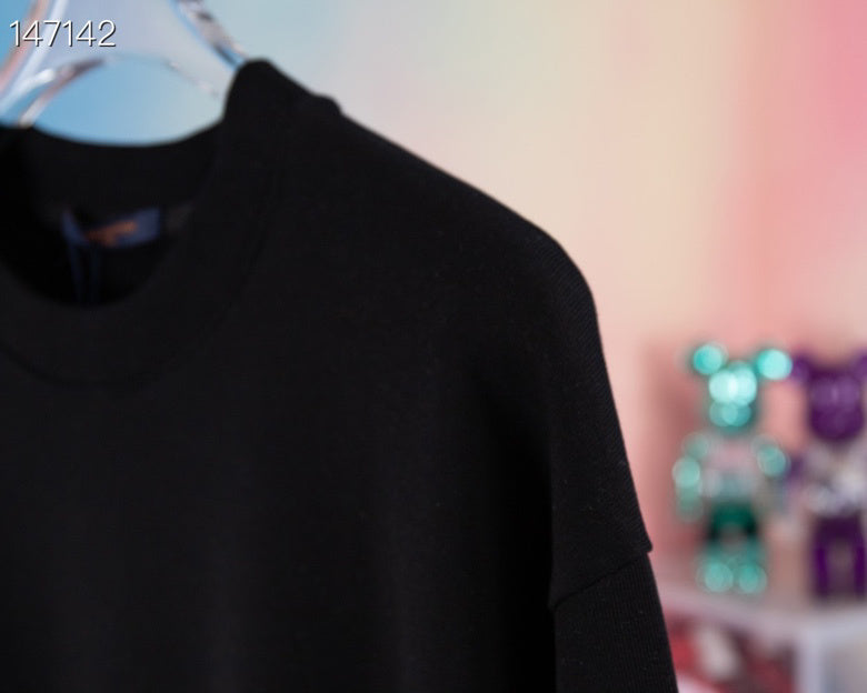 Side profile of Louis Vuitton luxury clothing with tailored silhouette