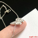 Angled view of Van Cleef & Arpels unisex jewelry piece