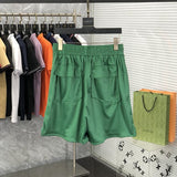 Side profile of Rhude luxury clothing with monogram-inspired silhouette