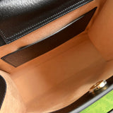 Side profile of statement chic women's handbag – women's luxury accessory