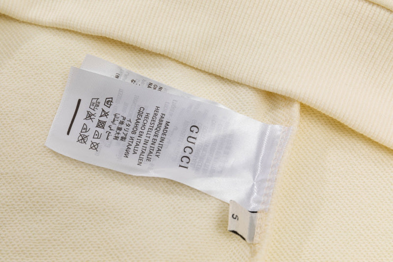 Close-up detail shot of Gucci luxury clothing with tailored silhouette