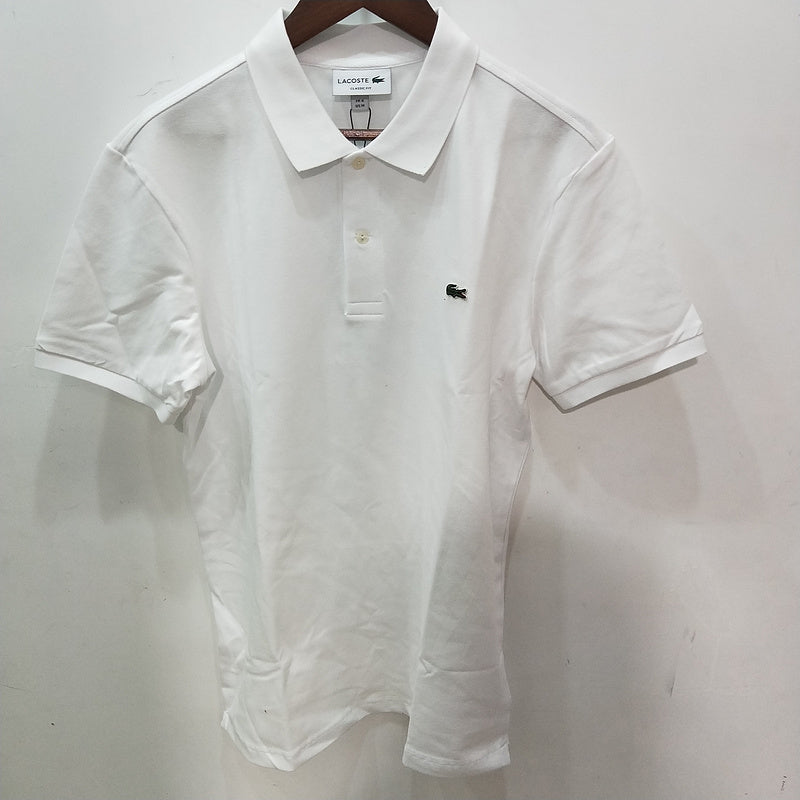 Close-up detail shot of Lacoste luxury clothing with monogram-inspired silhouette