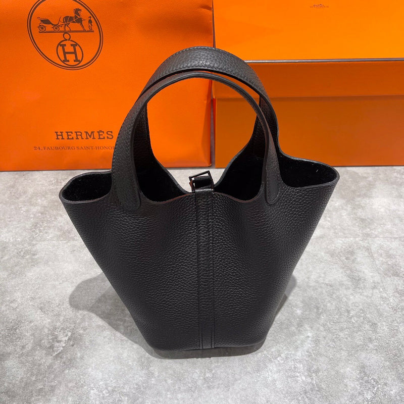 Side view of streamlined structured handbag