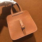 Side view of sculpted structured handbag