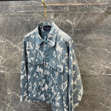 Close-up detail shot of Louis Vuitton luxury clothing with label-forward styling