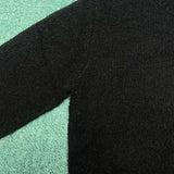 Flat lay presentation of Louis Vuitton luxury clothing with label-forward styling