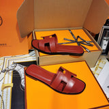 Hermès Grey Flat Thong Sandals - Close-Up Texture View