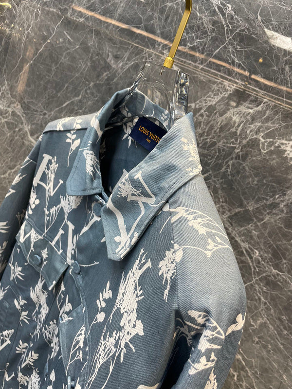 Flat lay presentation of Louis Vuitton luxury clothing with label-forward styling