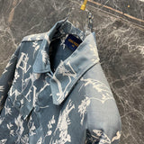 Flat lay presentation of Louis Vuitton luxury clothing with label-forward styling