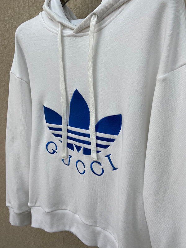 Flat lay presentation of Gucci luxury clothing with logo-detail design