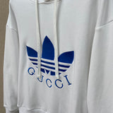 Flat lay presentation of Gucci luxury clothing with logo-detail design