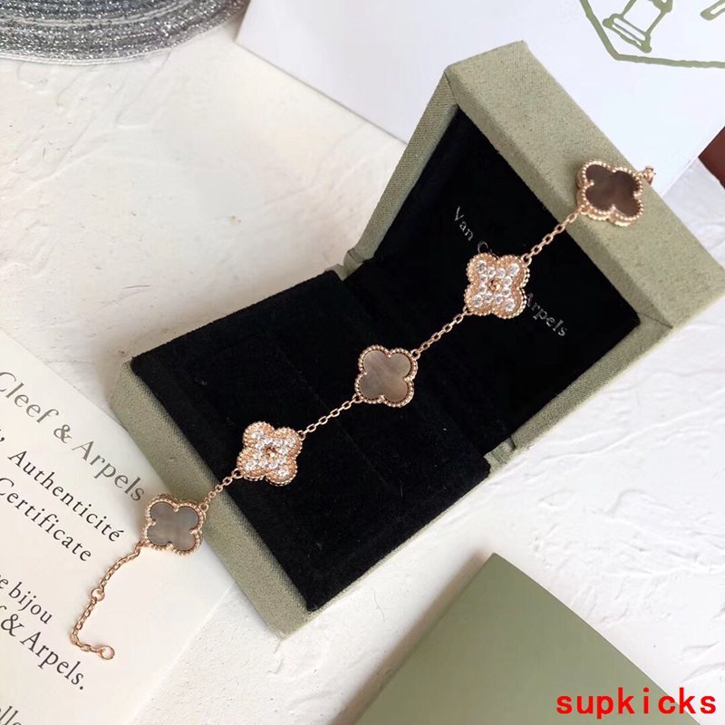 Lifestyle view of Van Cleef & Arpels unisex jewelry piece