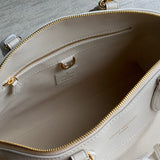  Polished top-handle bag carried on shoulder 28