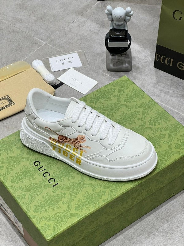 Side profile of Gucci bold contrast sneakers signature lace-up style
