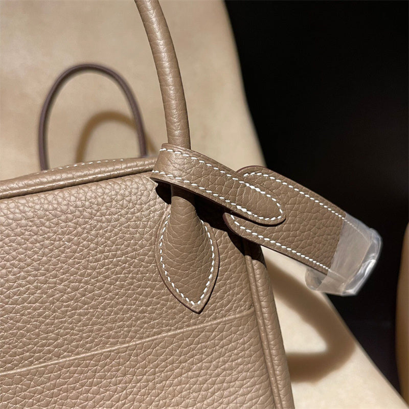 Side view of tailored structured handbag
