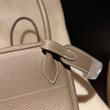 Side view of tailored structured handbag