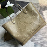 Handle and strap detail of signature elevated women's handbag – women's statement bag