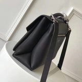 Handle and strap detail of chic modern women's handbag – women's designer-style accessory