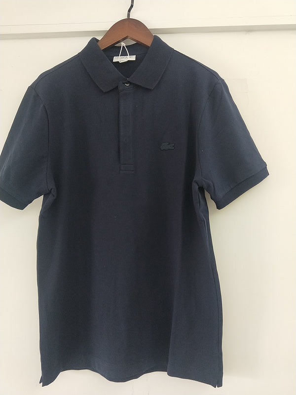 Close-up detail shot of Lacoste luxury clothing with signature branding